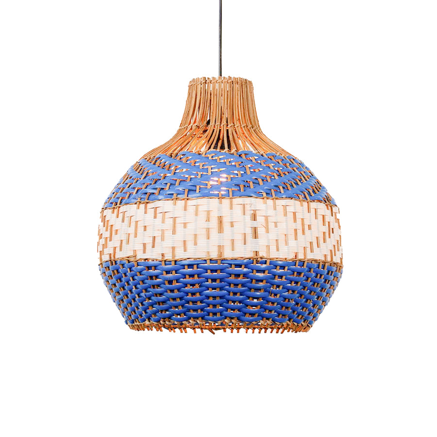 Handwoven rattan pendant light with blue and natural pattern and rounded shape hanging against soft neutral wall background for boho decor styling.