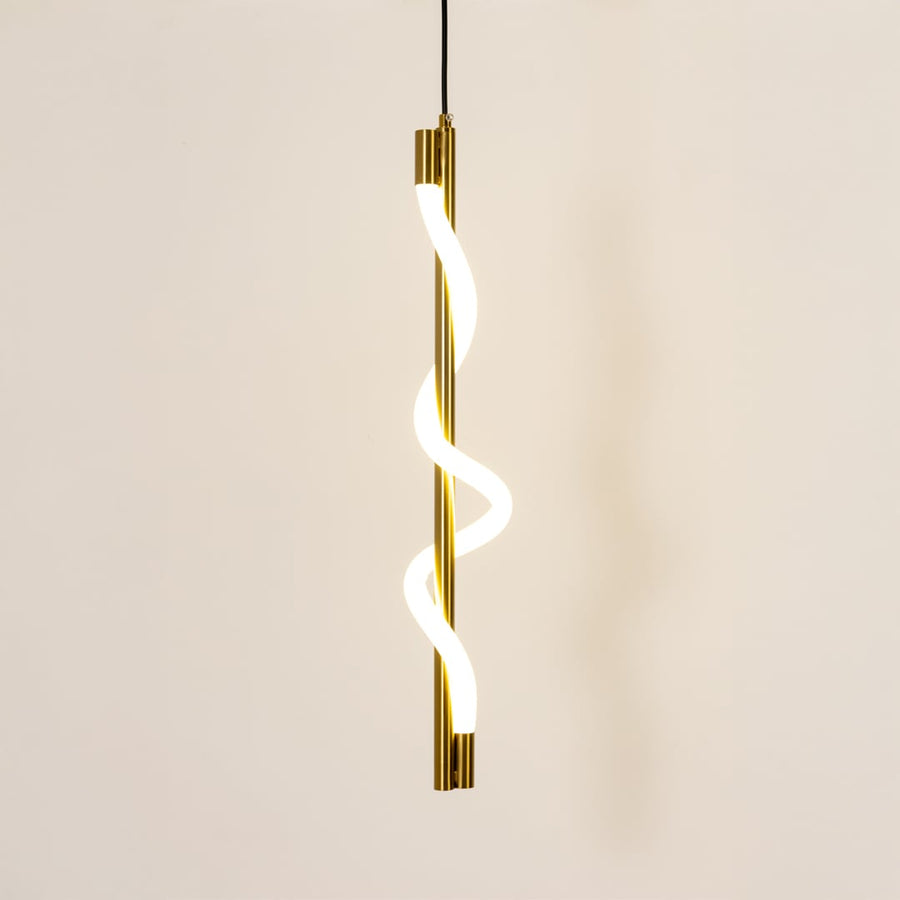 Gold metal spiral pendant light glowing softly on white background for modern living room kitchen island and dining decor.
