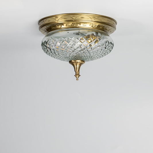 Antique brass crystal ceiling light with faceted glass shade for elegant hallway and classic home decor spaces.