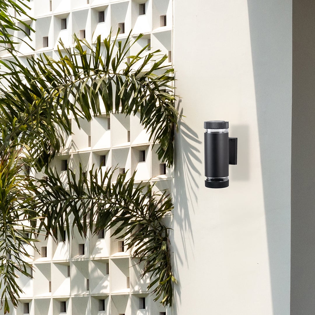 Stylish wall-mounted black light fixture blending function and form creating a refined modern ambiance for indoor or outdoor spaces.