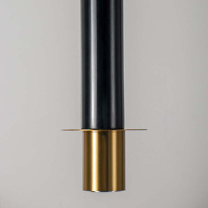 Closeup of black and gold cylindrical metal pendant light showcasing detailed finish and premium hanging ceiling design.