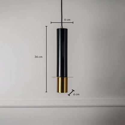 Black and gold cylindrical pendant ceiling light with height 36 cm and diameter 6 cm displayed on off white background.