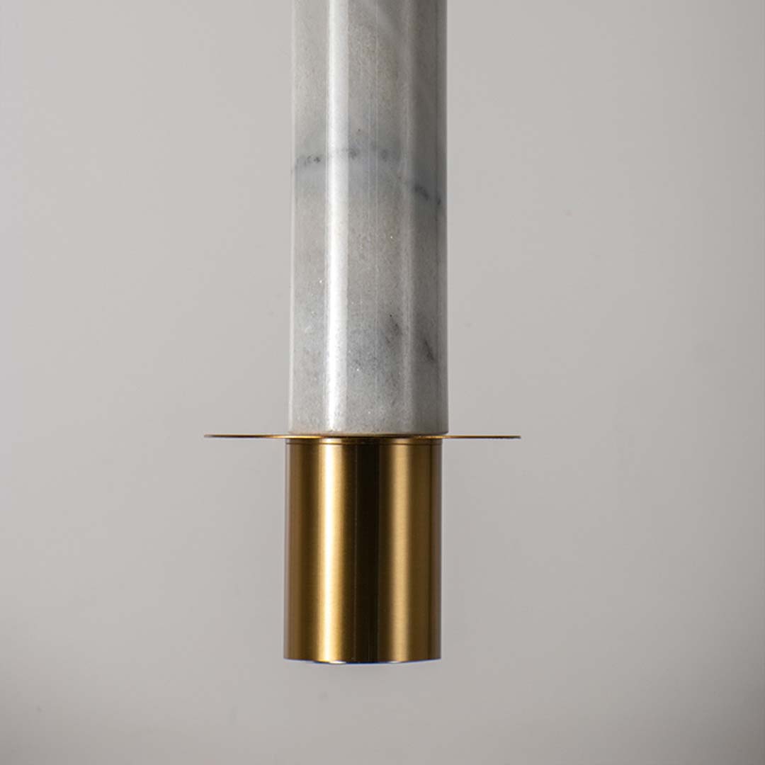 Elegant pendant lamp with white marble cylindrical body and brass gold detailing crafted for dining bedroom and hallway.
