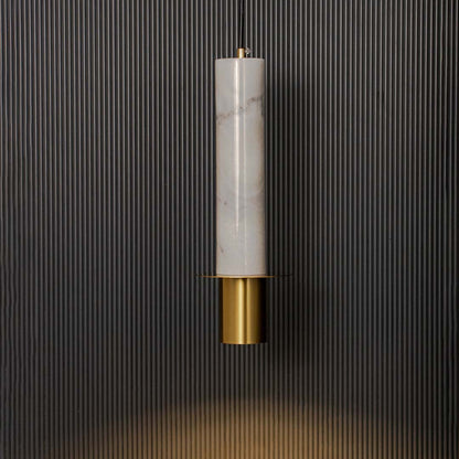 White marble and brass gold pendant light glowing warmly against dark wall creating a luxurious and modern ambience.