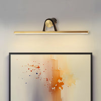 Black and gold metal picture light enhancing abstract wall art with focused illumination and contemporary interior appeal.