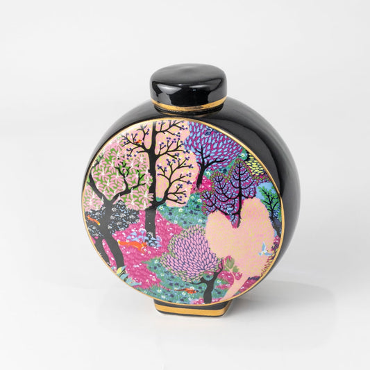 Round vase featuring pink floral artwork on a black background delivering designer artistic décor adding color sophistication and handcrafted beauty to stylish contemporary interiors.