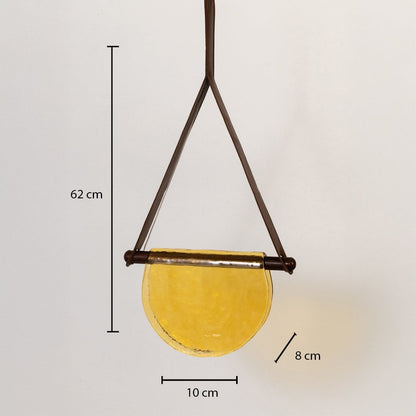 Pendant light with labeled measurements showing 62 cm height 10 cm width and 8 cm depth featuring a yellow half-moon glass shade.