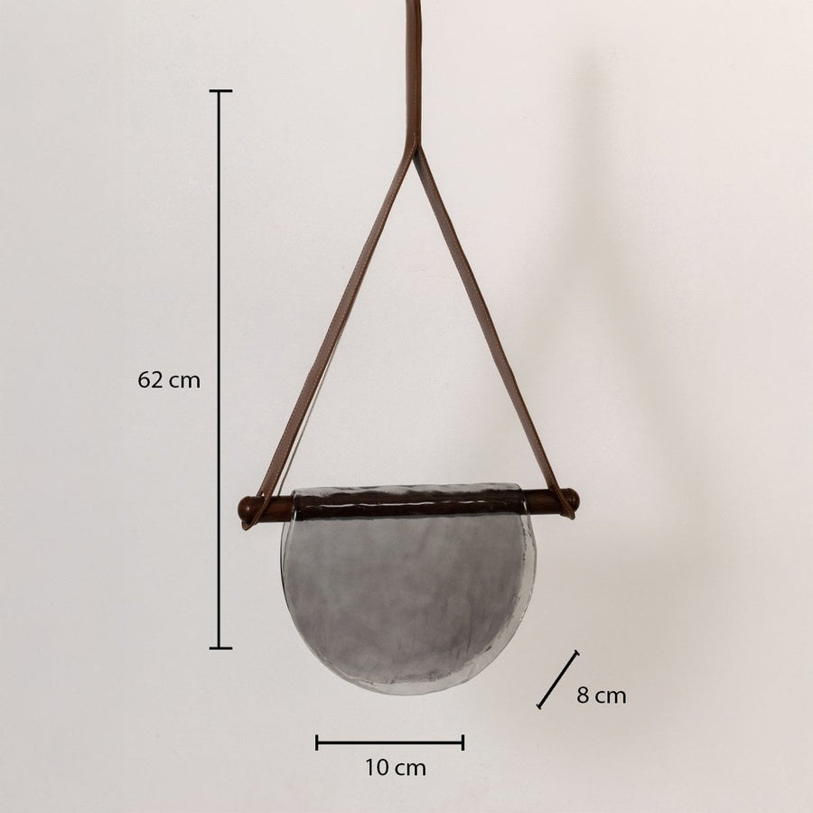 Pendant light with labeled dimensions: 62 cm height 10 cm width and 8 cm depth featuring a grey half-moon textured glass shade.