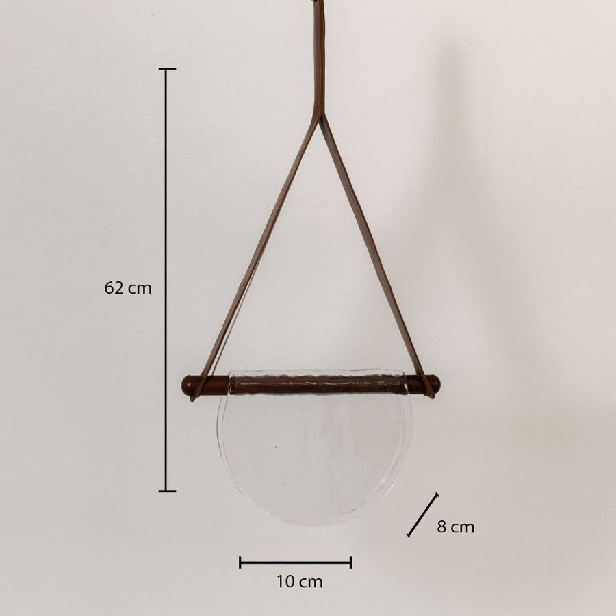 Pendant light with clear half-moon textured glass shade showing labeled dimensions: 62 cm height 10 cm width and 8 cm depth.