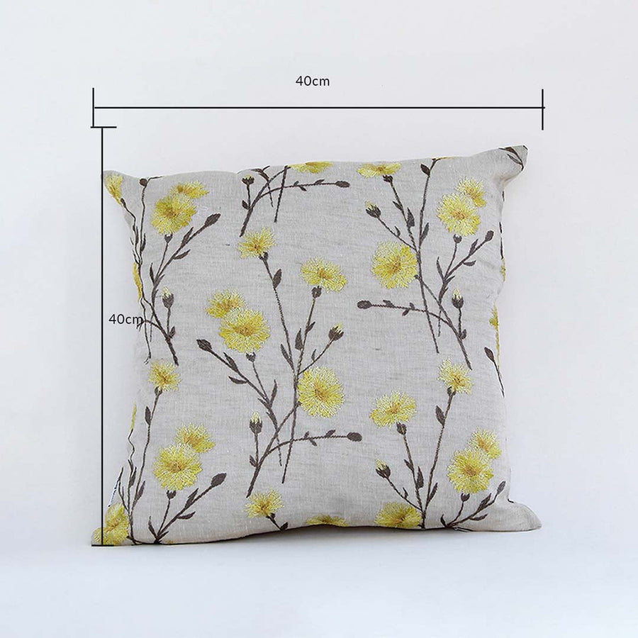 Yellow floral cushion cover shown with clear guides marking its 40 cm x 40 cm size offering a bright home décor accent for sofas beds and interior design setups.