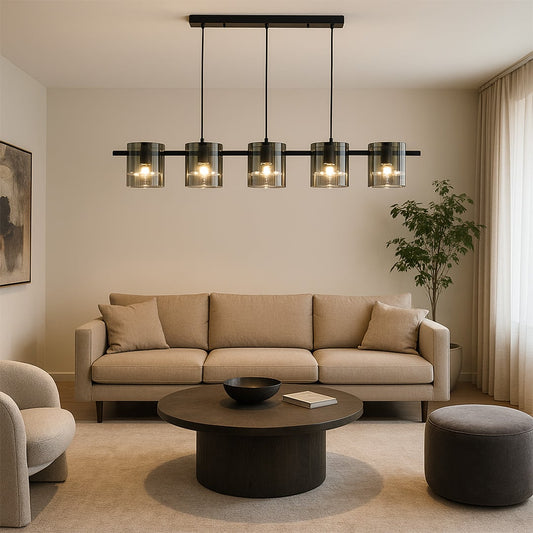 Black metal chandelier with five smoked glass shades styled in a modern dining room creating warm elegant ambient lighting decor.