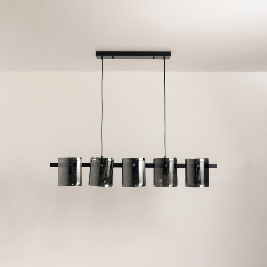 Black metal chandelier with smoked glass shades shown on a bright white background with lights off for a sleek modern look.