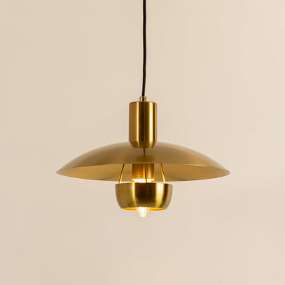 Gold metal pendant light with dome shade illuminated to showcase modern ceiling lighting and premium decorative appeal.