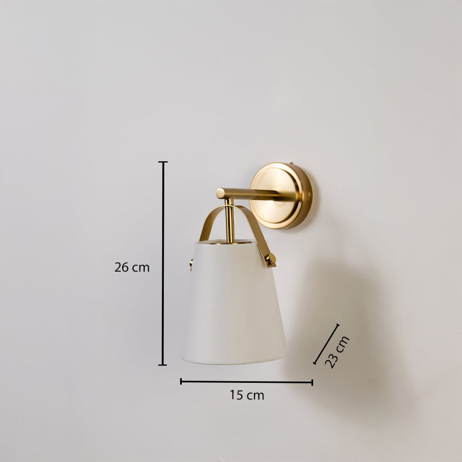 Gold metal wall light with white fabric shade shown with 26 cm height 15 cm width and 23 cm depth for accurate indoor wall placement.