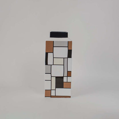 Handcrafted ceramic vase featuring geometric square design in black brown and white ideal for modern home decoration.
