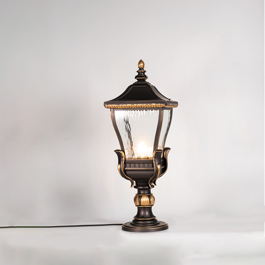 Vintage black outdoor gate light with warm glowing bulb for elegant exterior decor styling use.