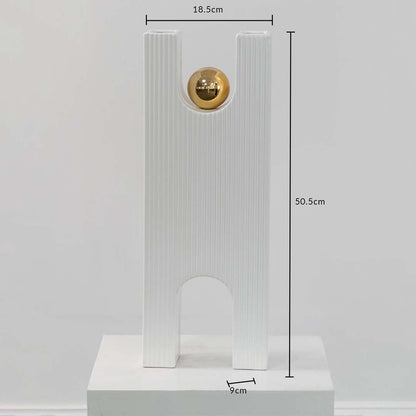 White ribbed sculpture with gold sphere shown with 50.5 cm height 18.5 cm width and 9 cm depth offering accurate size reference.