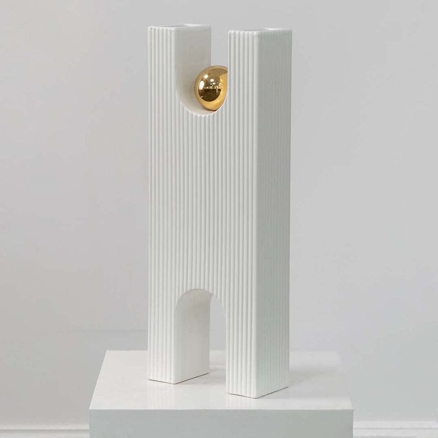 White textured decorative sculpture with gold sphere displayed on a clean white background highlighting its modern artistic form.