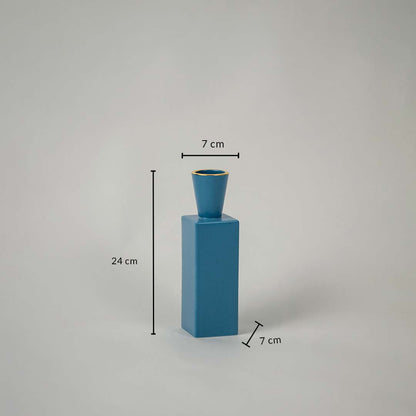 Dimension image of a blue geometric vase showing height 24 cm  top width 7 cm  and base width 7 cm against a white background.