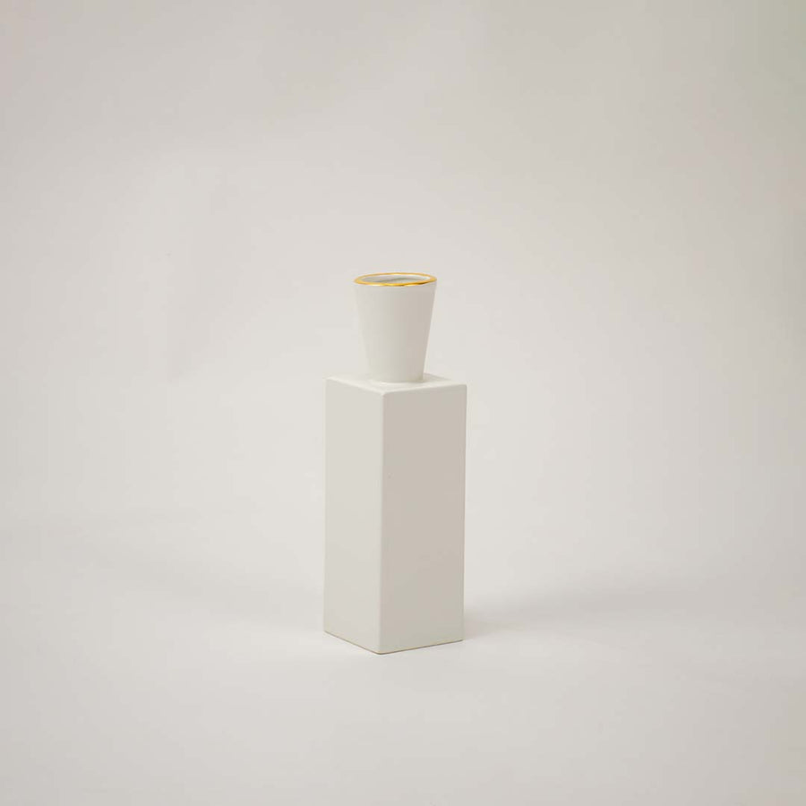 White ceramic geometric decorative vase with tall modern silhouette for tabletop styling and contemporary home decor.