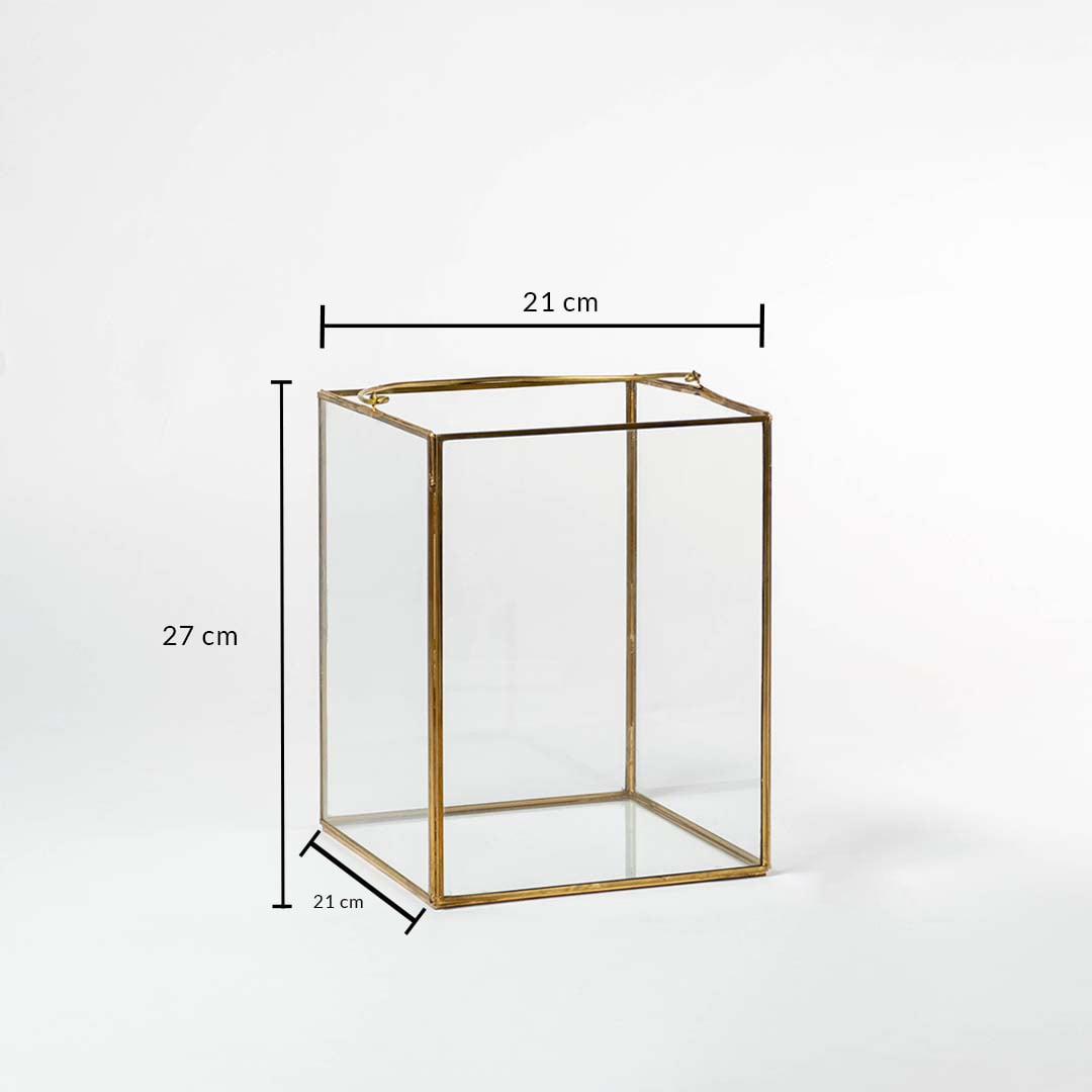 Rectangular gold metal decor stand with glass sides showing 21 cm width 21 cm depth and 27 cm height for display use.