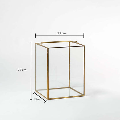 Rectangular gold metal decor stand with glass sides showing 21 cm width 21 cm depth and 27 cm height for display use.