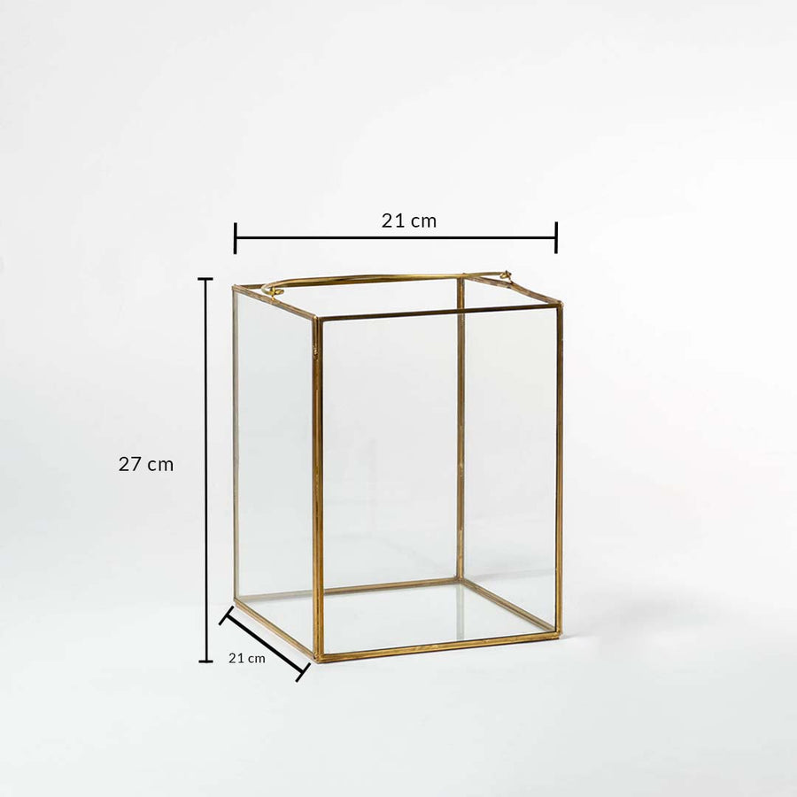 Rectangular gold metal decor stand with glass sides showing 21 cm width 21 cm depth and 27 cm height for display use.