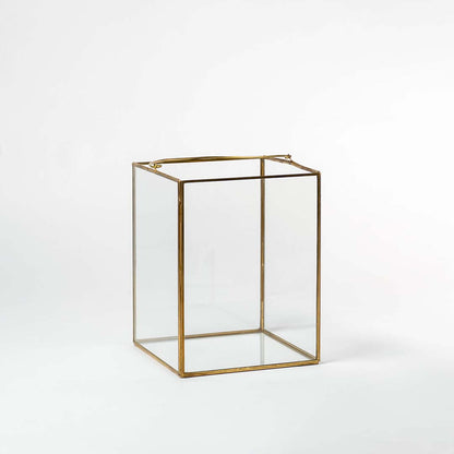 Cuboid decorative glass box with golden frame shown on white background perfect for stylish storage and modern interiors.