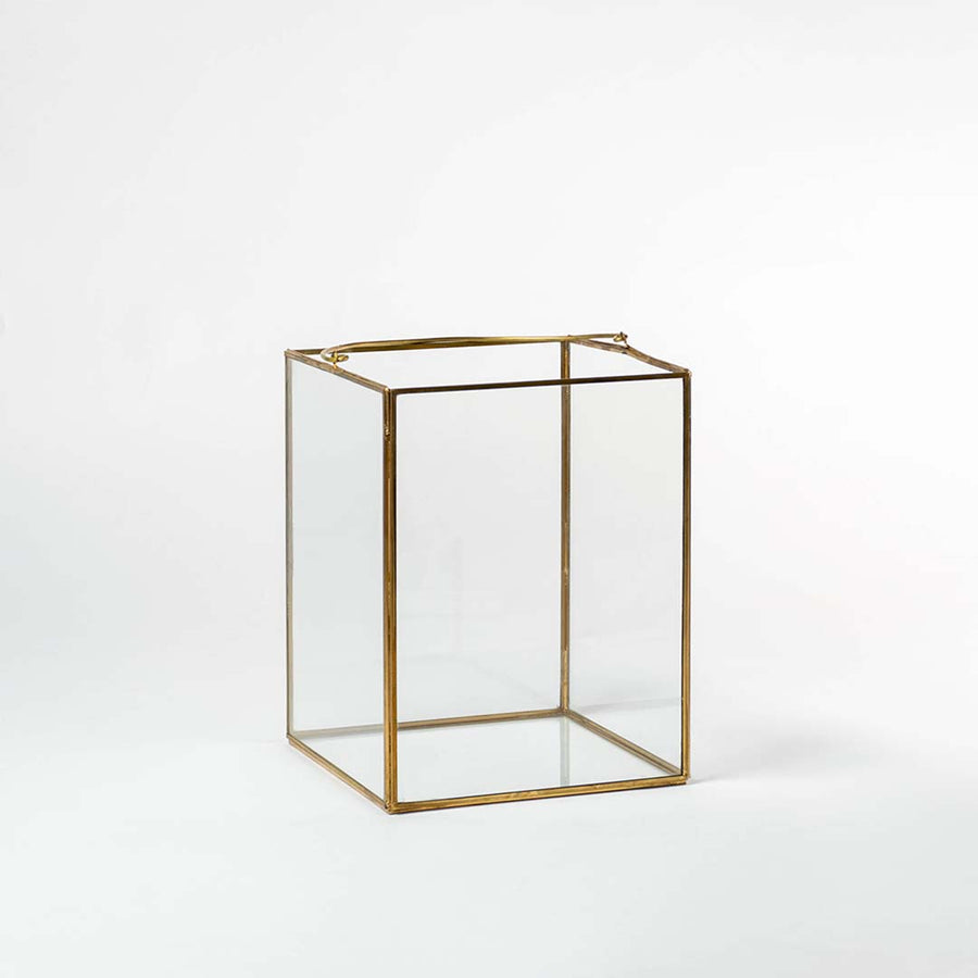 Cuboid decorative glass box with golden frame shown on white background perfect for stylish storage and modern interiors.