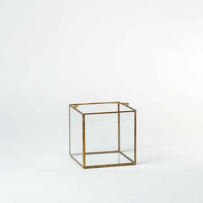 Cube decorative glass box with golden frame shown on white background perfect for storage and stylish home accessories.