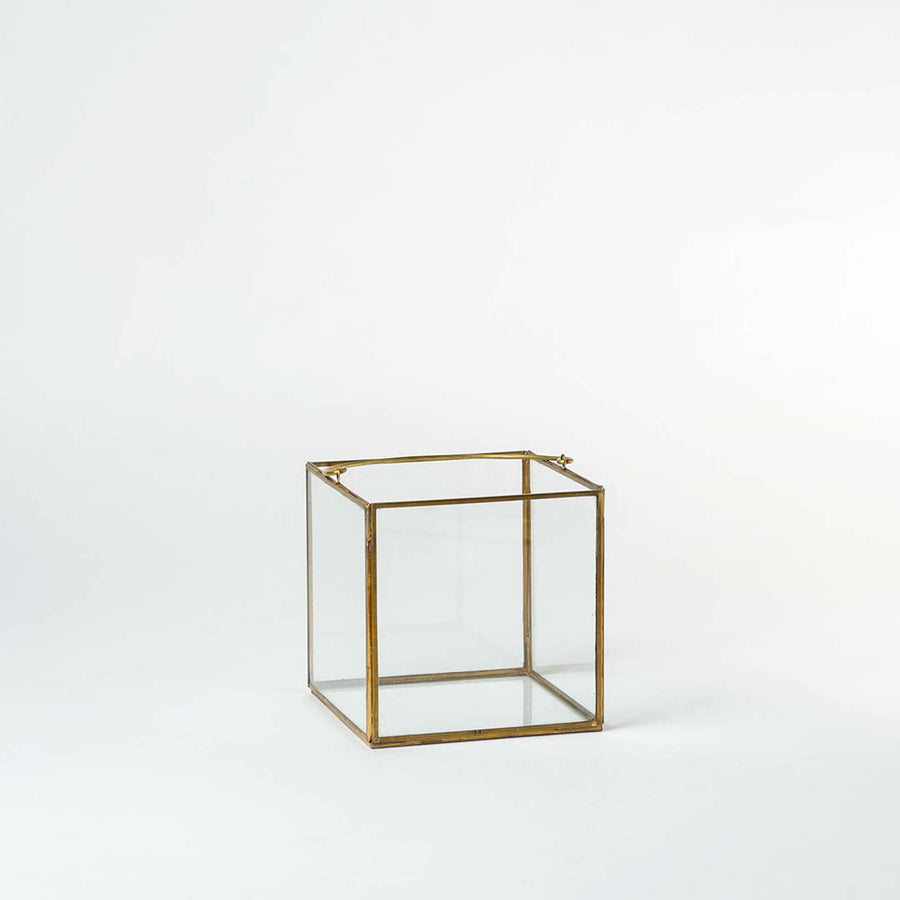 Cube decorative glass box with golden frame shown on white background perfect for storage and stylish home accessories.