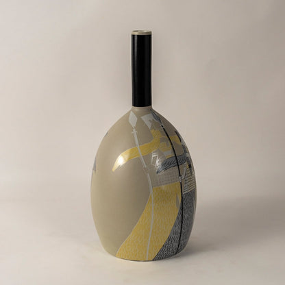 Elegant beige ceramic vase with tribal warrior motif captured on plain white background perfect for home interior styling.