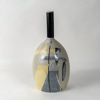 Elegant beige ceramic vase with tribal warrior motif captured on plain white background perfect for home interior styling.