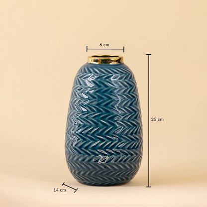Blue ceramic vase with gold rim featuring 25 cm height 14 cm base width and 6 cm top diameter displayed on a beige background.