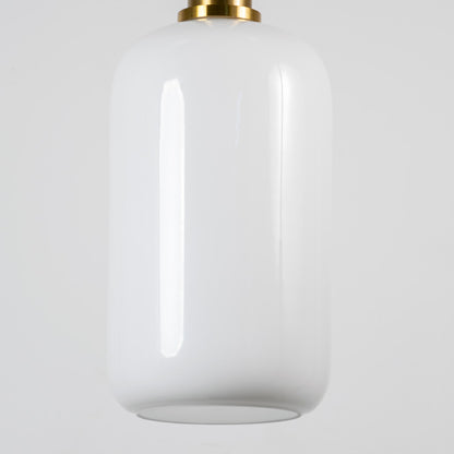 White glass pendant light with brass metal fixture showcasing smooth glossy finish and refined contemporary lighting style.