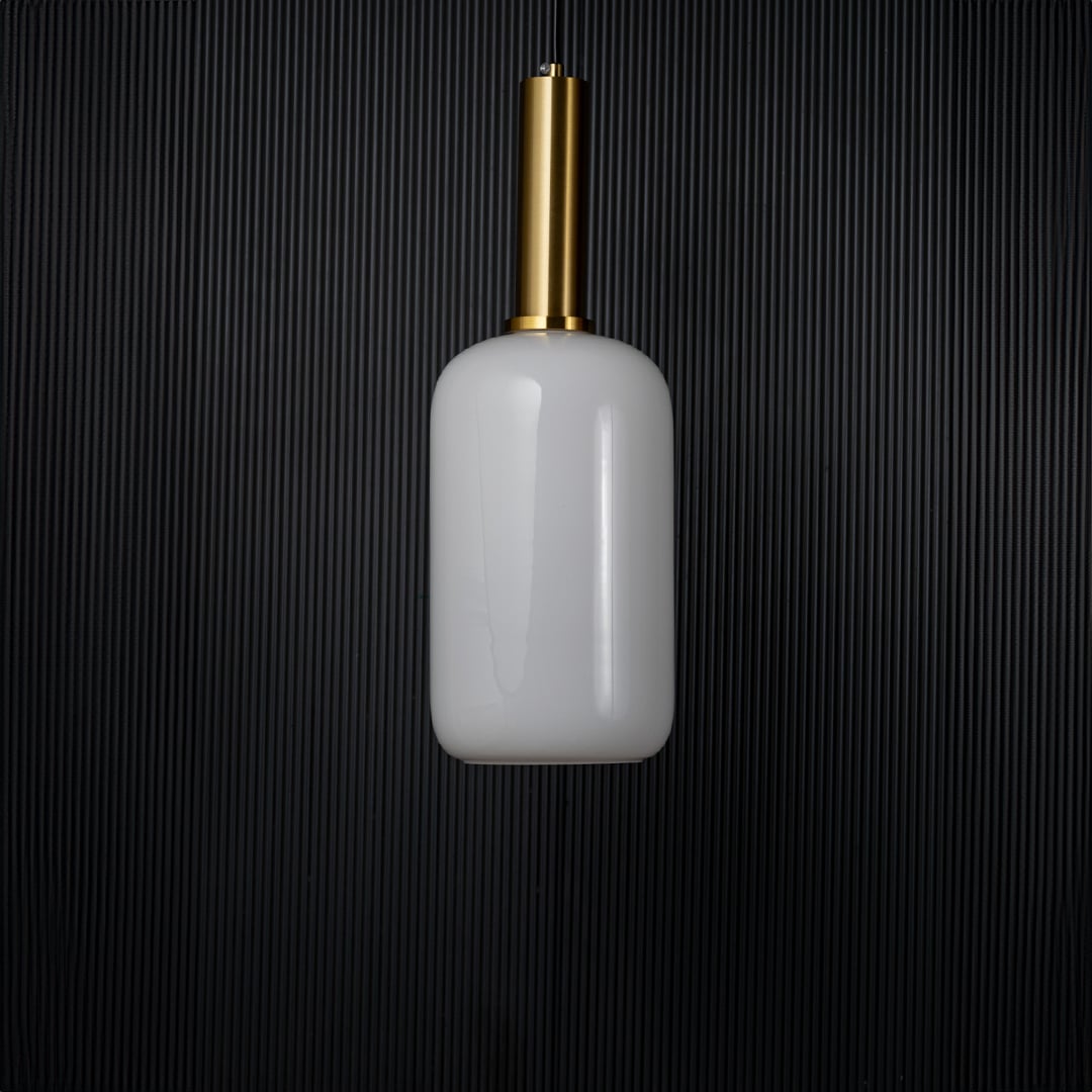 Modern white glass pendant light turned off with golden holder displayed elegantly on black background decor.