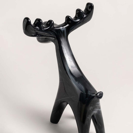 Black ceramic moose figurine with marble swirl detail shown from side angle for decorative styling reference.