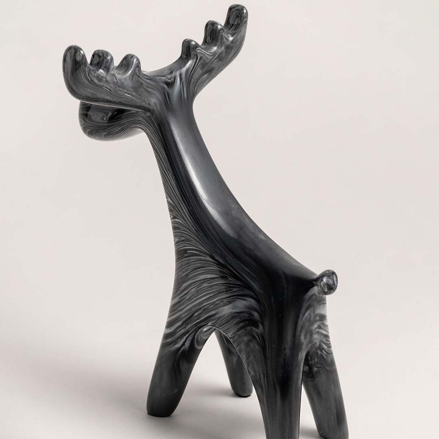 Black marble finish moose figurine displayed from side angle showing sculptural detail for modern home decoration.