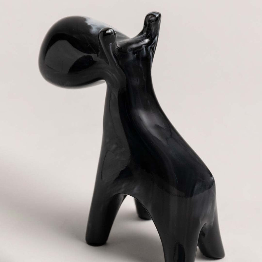 Black marble swirl moose figurine displayed from side angle showing artistic sculptural detail for home styling.