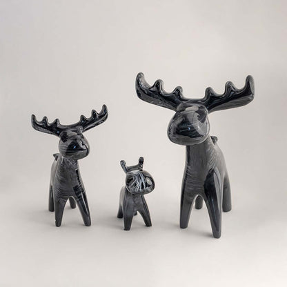 Set of grey decorative deer figurines with modern sculptural design for elegant tabletop styling and home decor.