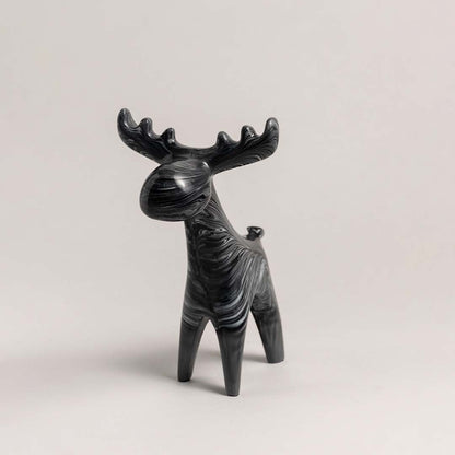 Black ceramic moose figurine with marble swirl detail displayed on plain white background for decor styling.
