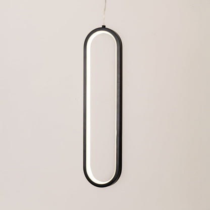 Modern metal elongated loop hanging light in black and white glowing softly on white background for stylish wall decor.