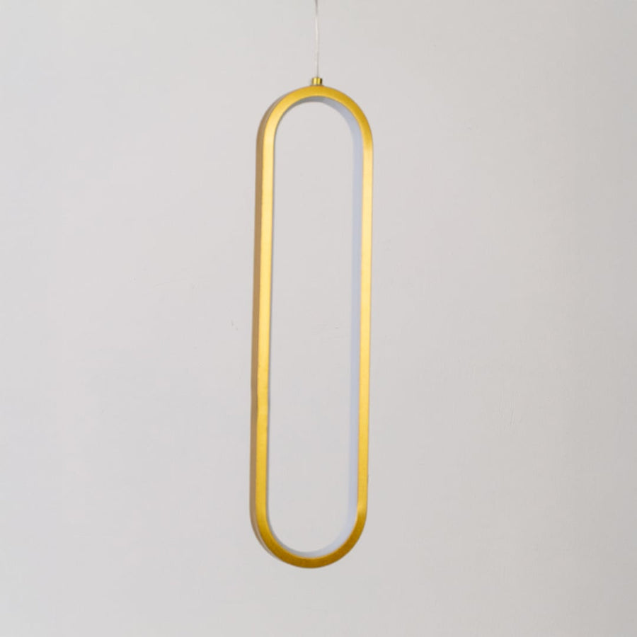 Modern metal elongated loop hanging light in gold shown switched off on white background for minimal wall decor.