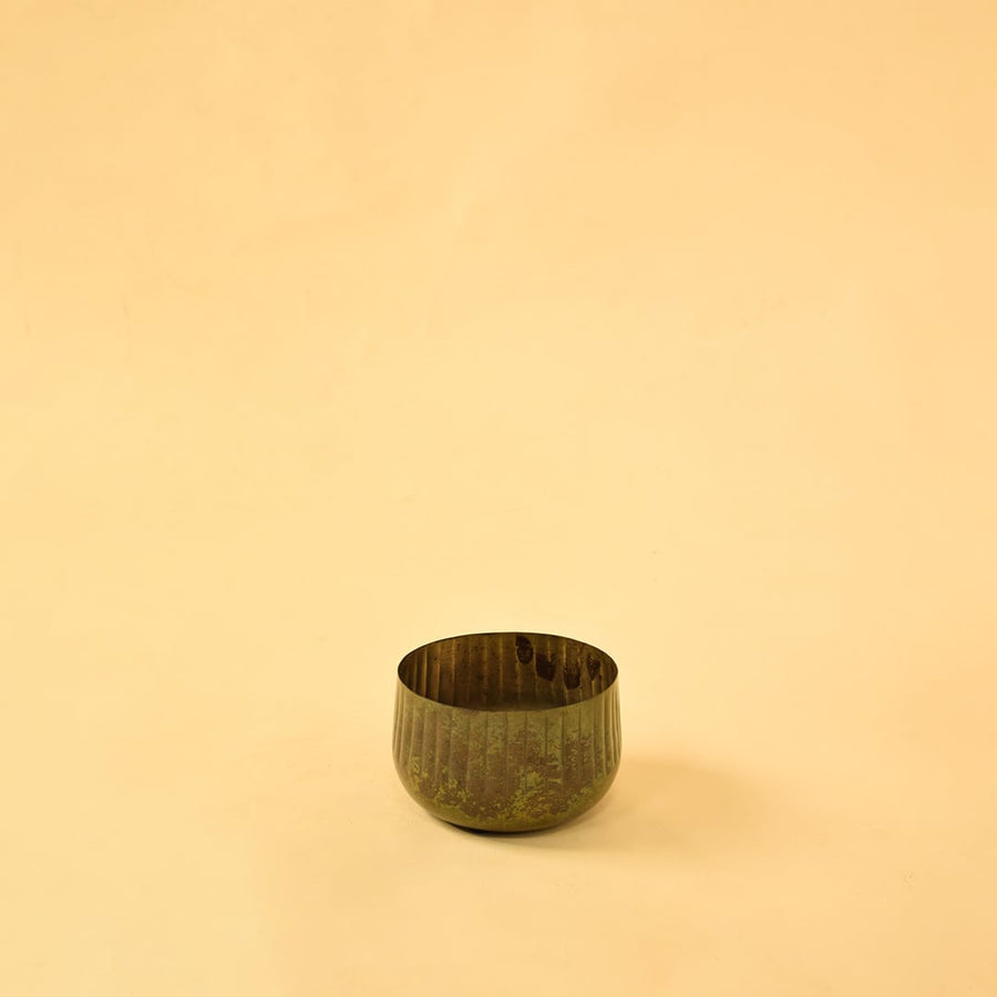 Bronze ribbed metal bowl planter on a clean white background suitable for modern simple and natural home styling.