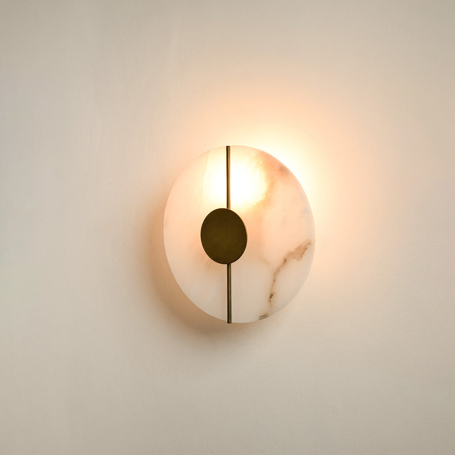 Modern marble wall light with warm ambient glow for stylish bedroom and premium decor styling spaces.

