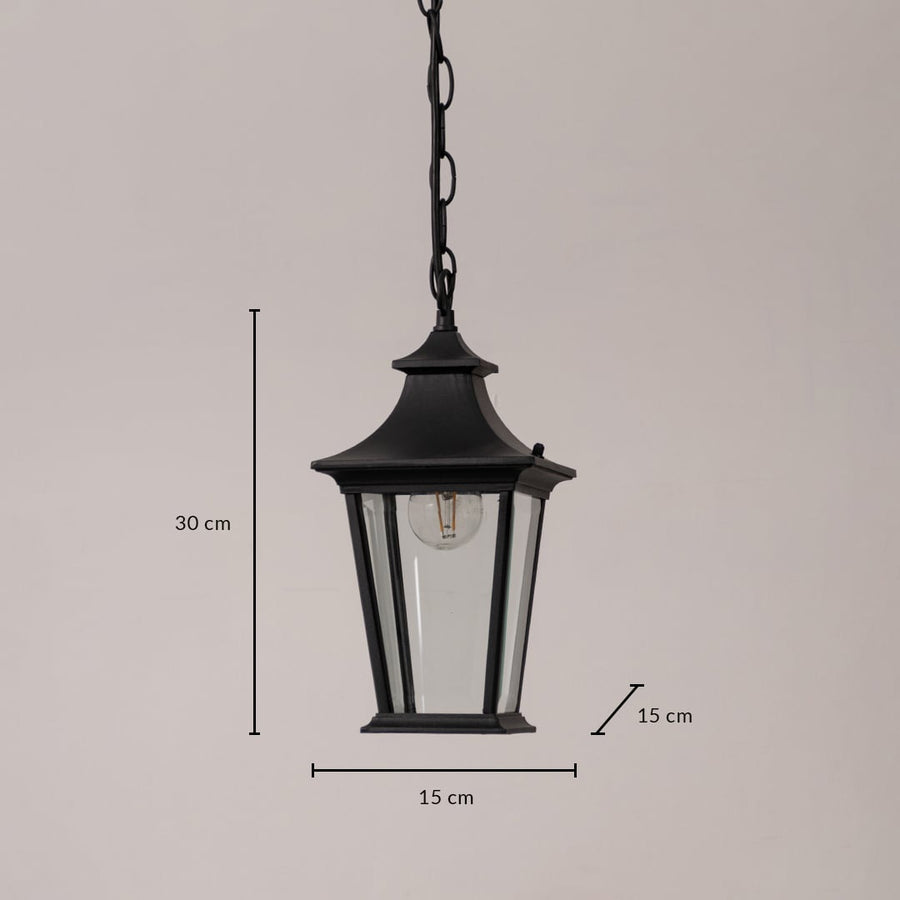 Black metal hanging lantern with clear glass panels shown with 30 cm height and 15 cm width measurements for size clarity.