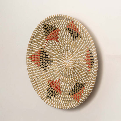 Side angle of round basket wall decor highlighting woven texture thickness and handcrafted details.