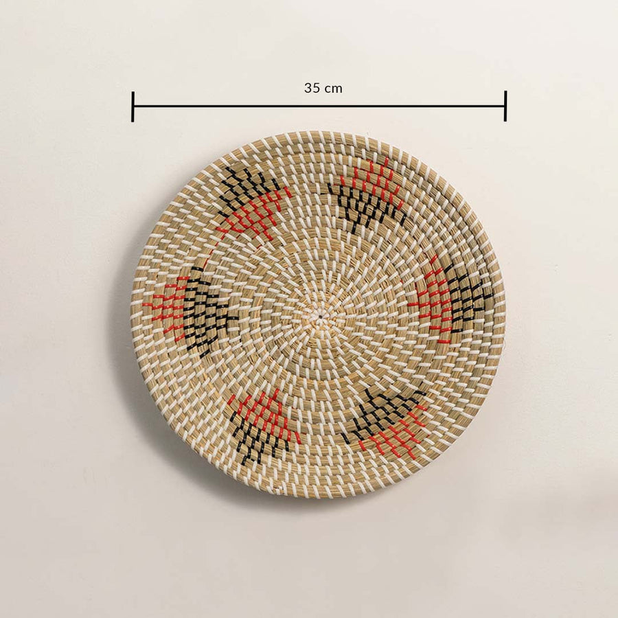 Basket wall decor measuring 35 cm diameter with natural handwoven cane and terracotta accents.