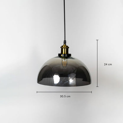 Dome pendant light with smokey glass shade brass fitting and black cord shown with 24cm height and 30.5cm width.