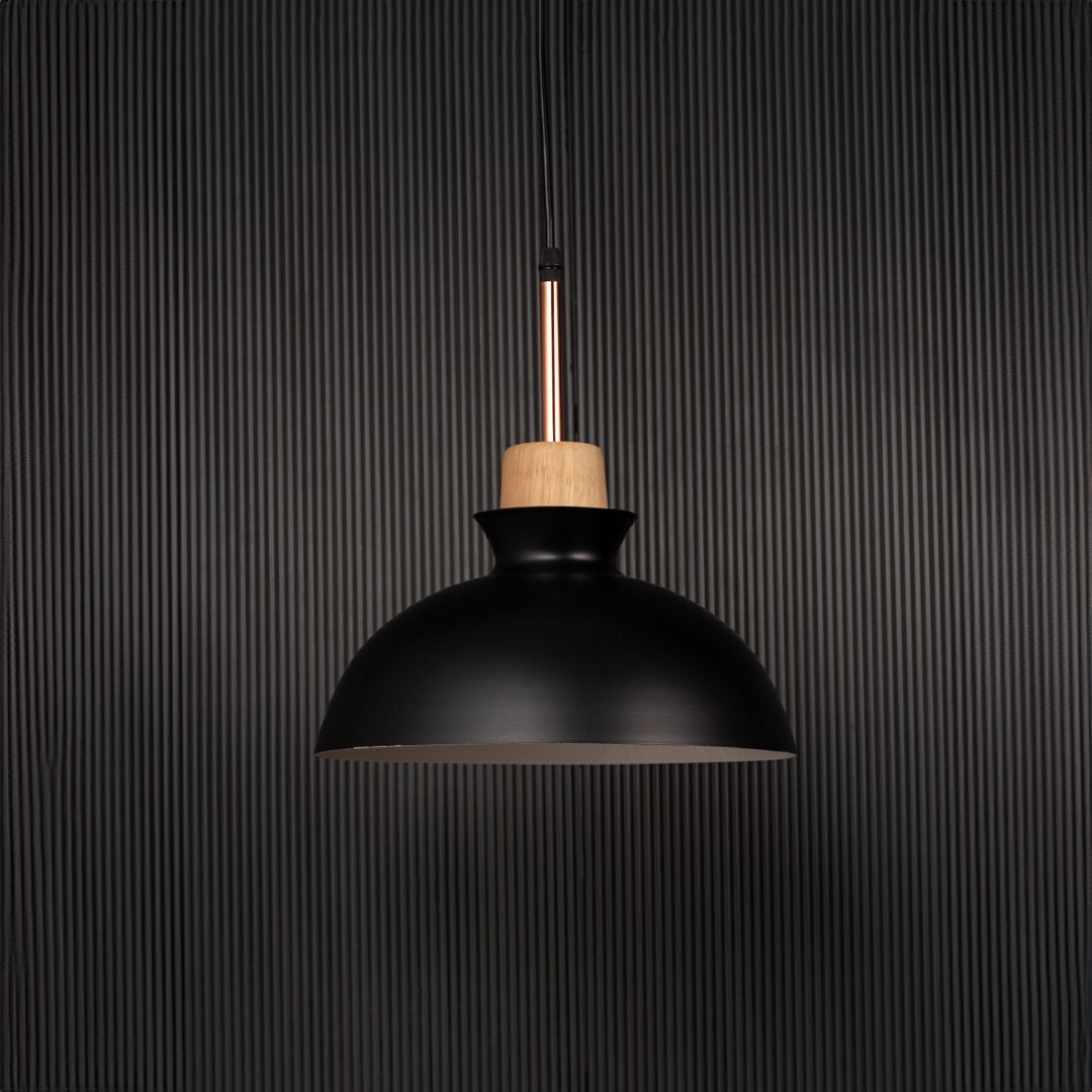 Black dome pendant ceiling light with wooden accent switched off on back background for modern dining room cafe and kitchen lighting.